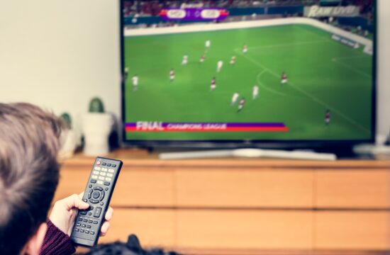 Couple watching a football game on TV