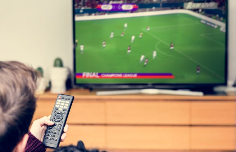 Couple watching a football game on TV